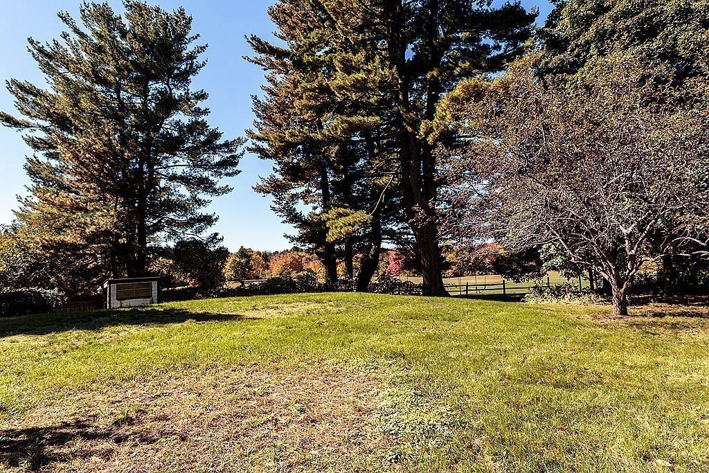 24 Old Ayer Road Groton, MA 01450 - Photo 27 of 29 a view of swimming pool with trees in the background