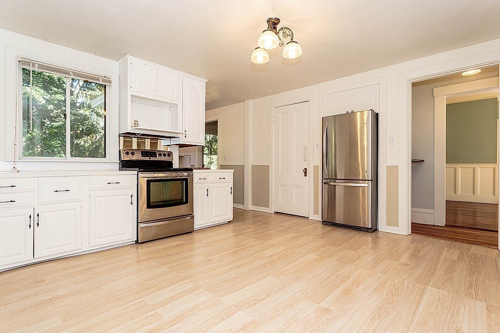 24 Old Ayer Road Groton, MA 01450 - Photo 8 of 29 a kitchen with stainless steel appliances a refrigerator sink and microwave