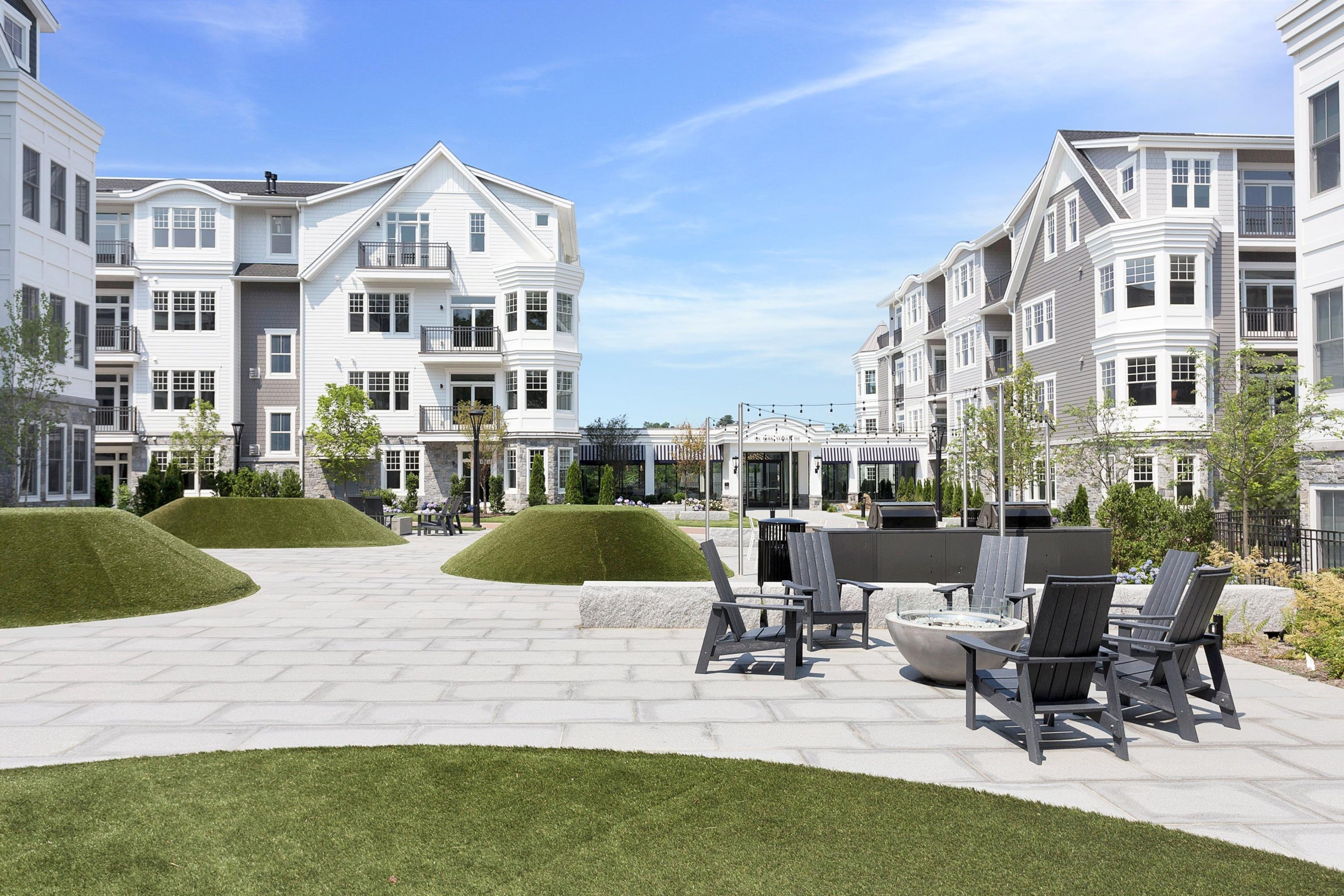 180 Park Street, Unit 304 New Canaan, CT 06840 - Photo 1 of 33 a view of a building with sitting area and sitting area