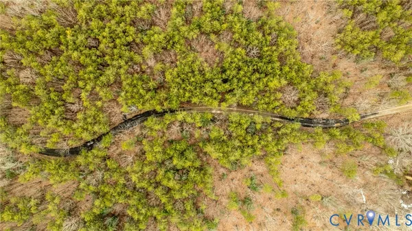 a view of wooden fence and trees