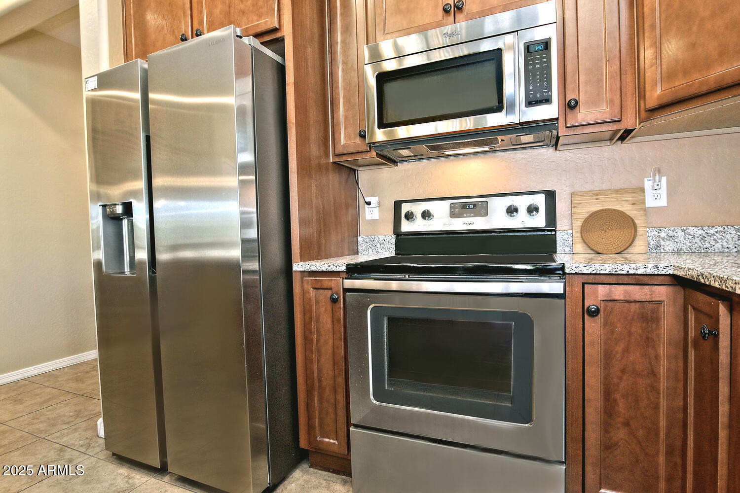 7382 West Silver Spring Way Florence, AZ 85132 - Photo 14 of 89 a stove top oven sitting inside of a kitchen