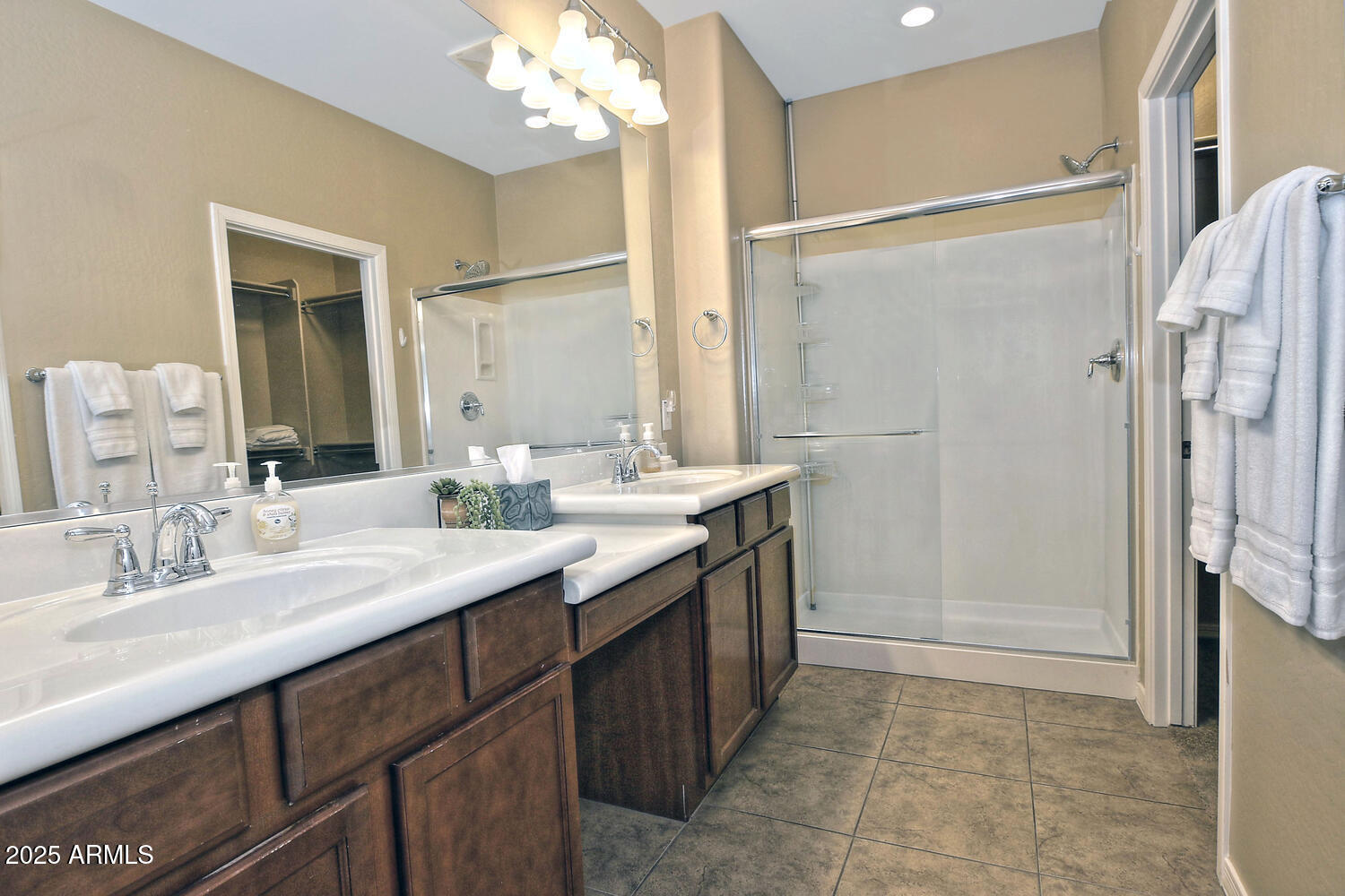 7382 West Silver Spring Way Florence, AZ 85132 - Photo 29 of 89 a bathroom with a double vanity sink mirror and shower