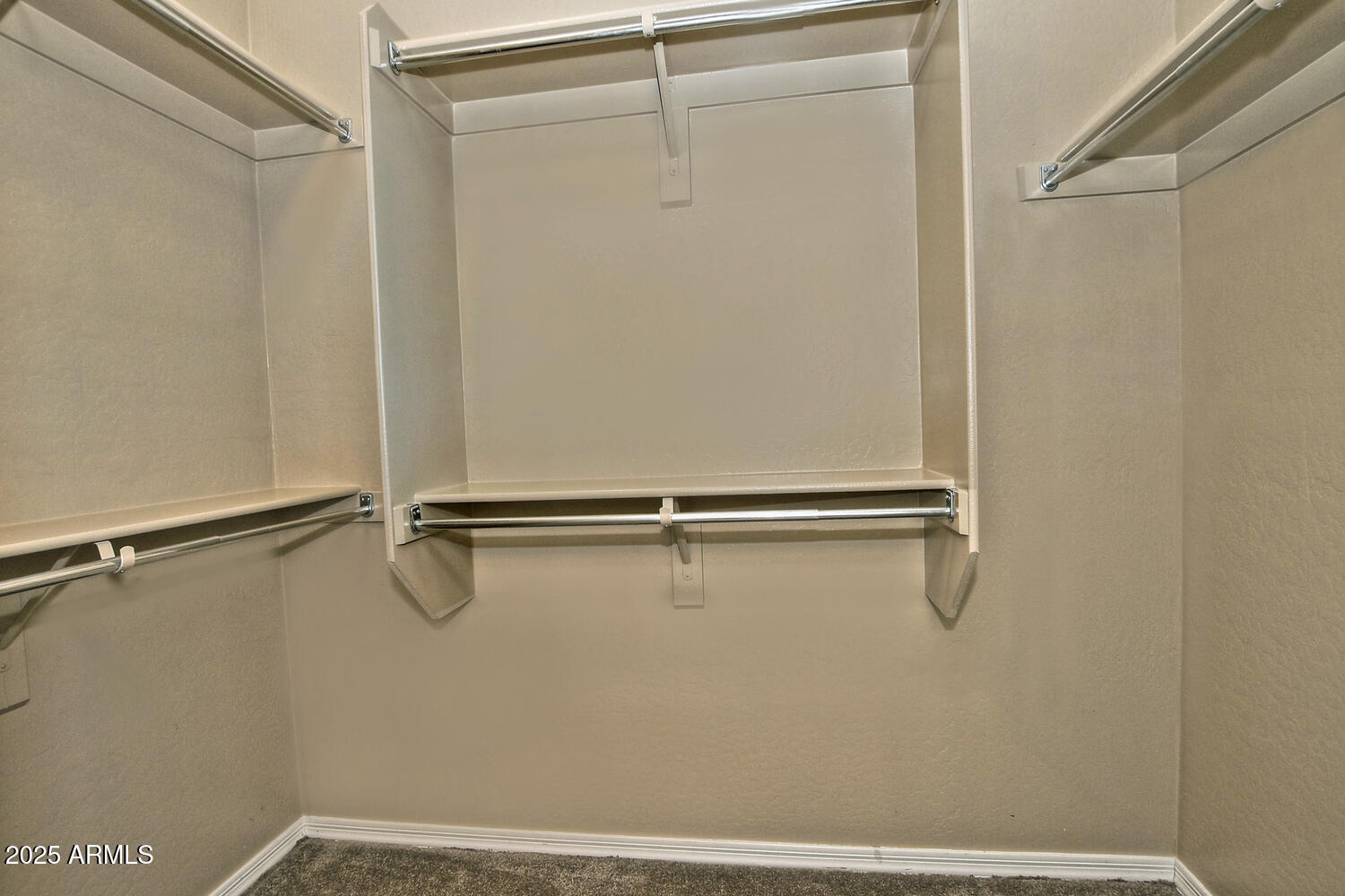 7382 West Silver Spring Way Florence, AZ 85132 - Photo 31 of 89 a view of a room with racks on the wall