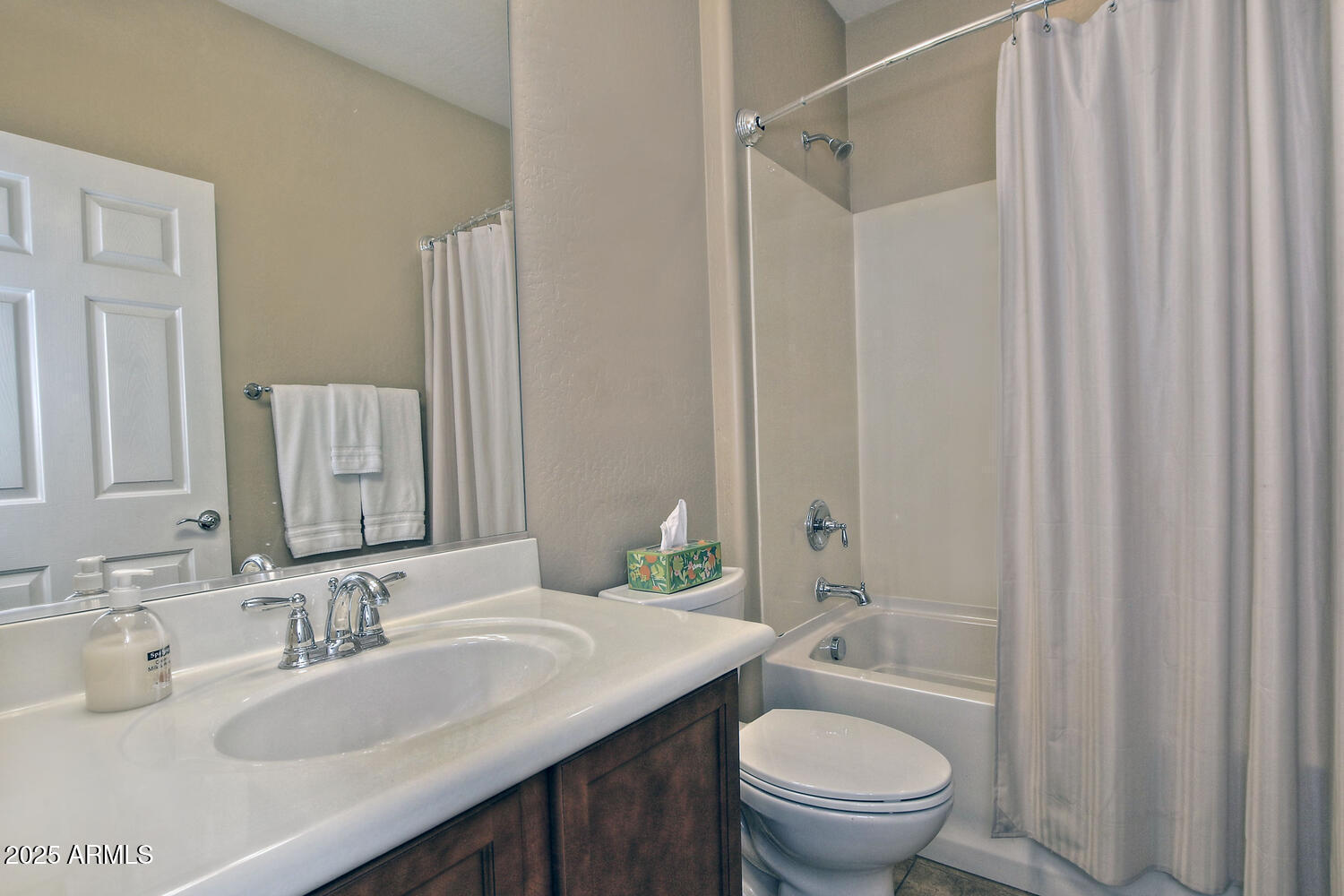 7382 West Silver Spring Way Florence, AZ 85132 - Photo 34 of 89 a bathroom with a granite countertop sink toilet a mirror and shower