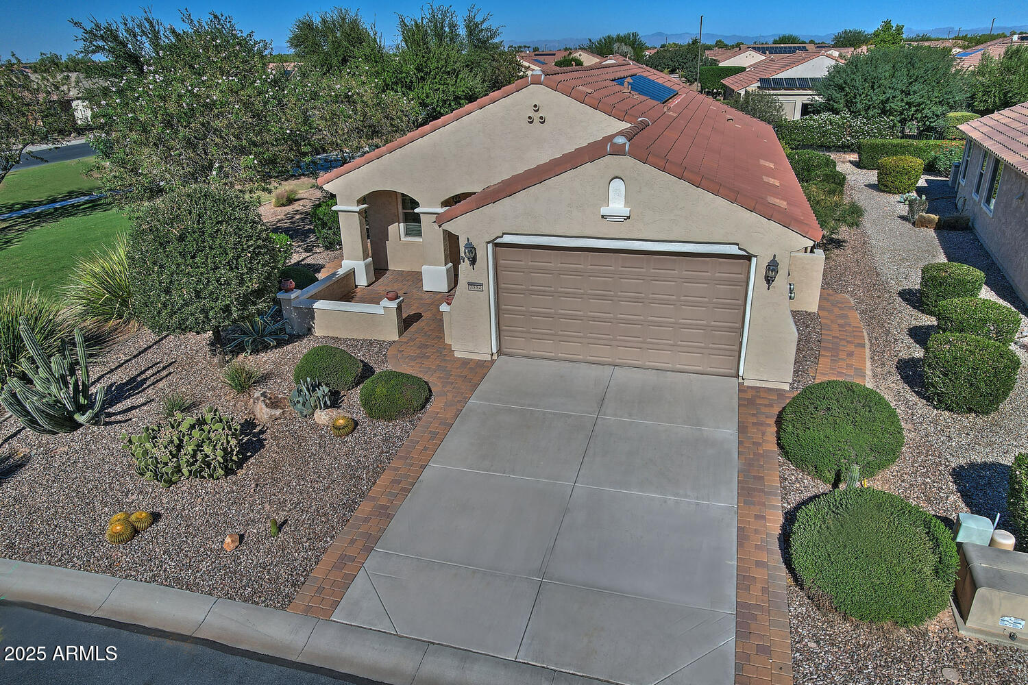 7382 West Silver Spring Way Florence, AZ 85132 - Photo 43 of 89 a front view of a house with garden