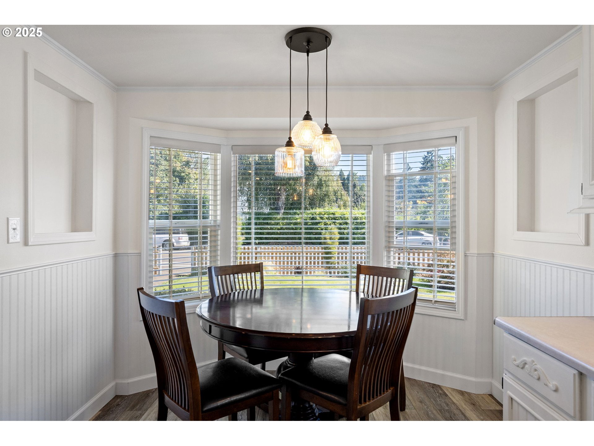 1115 South 6th Street Cottage Grove, OR 97424 - Photo 10 of 38 a view of a dining room with furniture wooden floor and chandelier