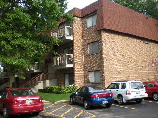 a view of a car parked in front of a house
