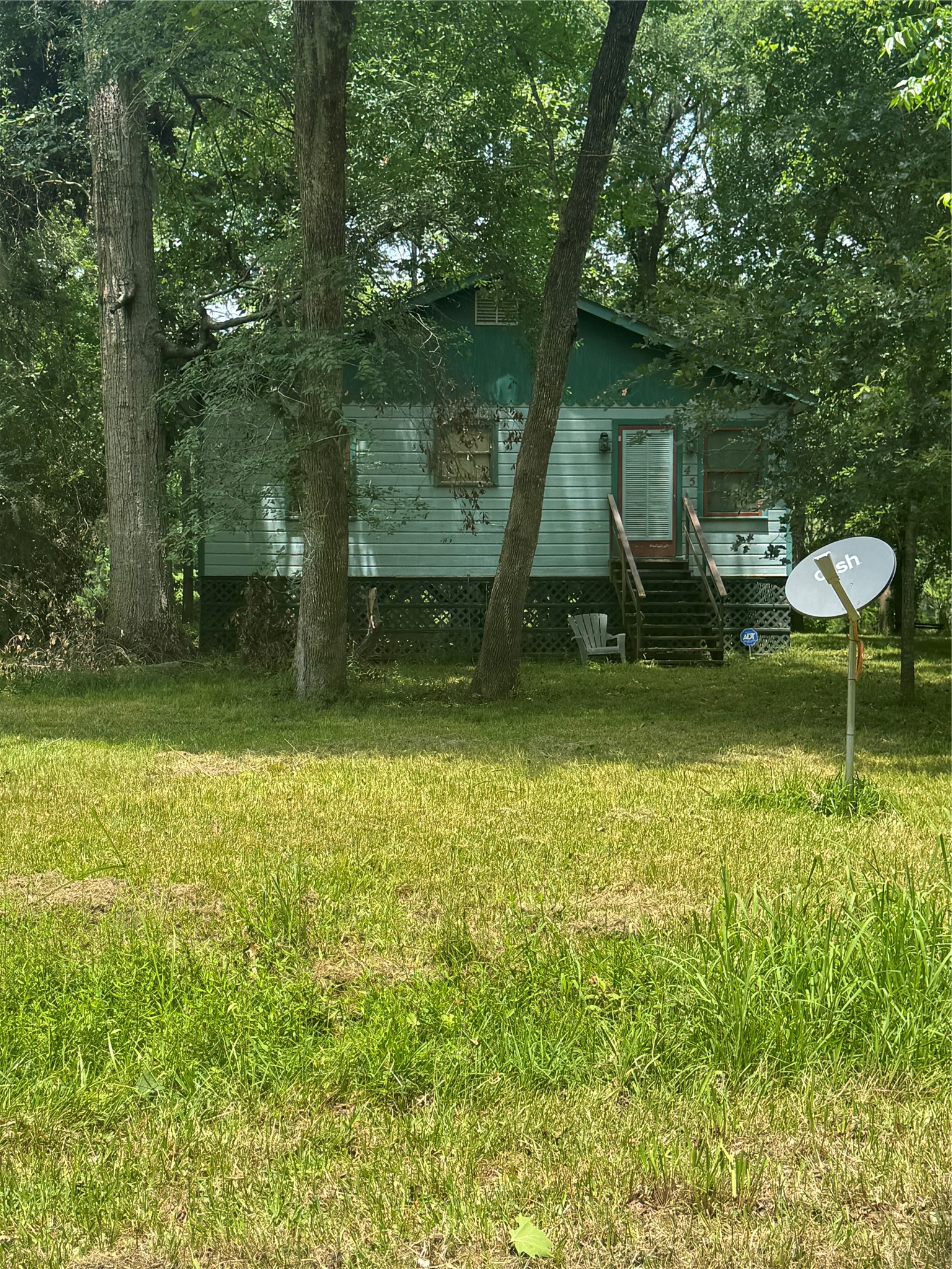 45 County Road 2859 Cleveland, TX 77327 - Photo 10 of 15 a view of a garden with a slide