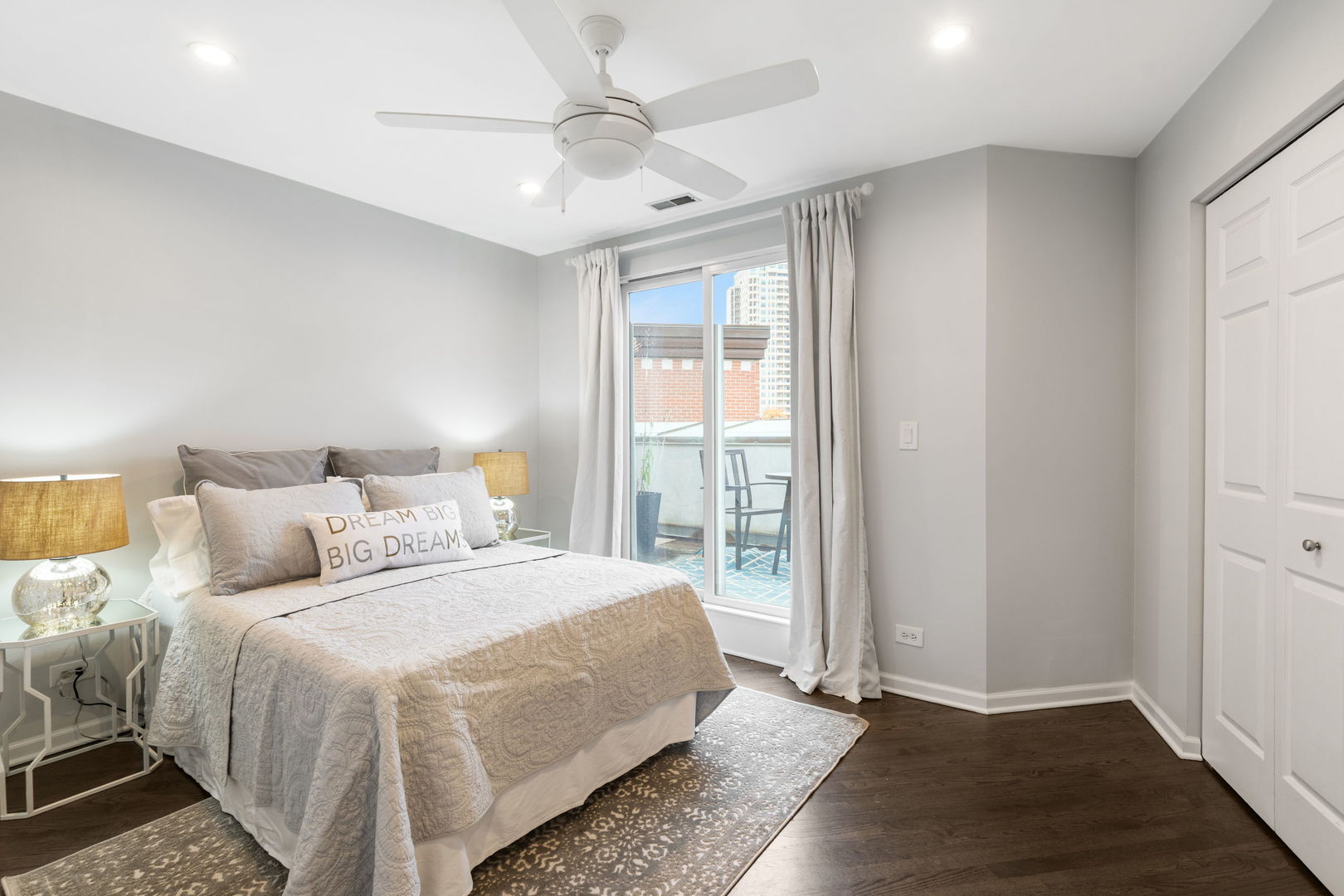 1522 South Prairie Avenue, Unit H Chicago, IL 60605 - Photo 18 of 25 a bedroom with a large bed and a chandelier