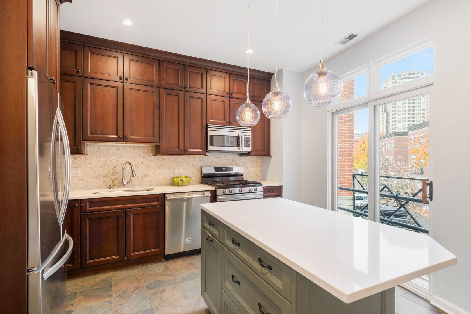 1522 South Prairie Avenue, Unit H Chicago, IL 60605 - Photo 7 of 25 a kitchen with stainless steel appliances granite countertop a sink stove and refrigerator