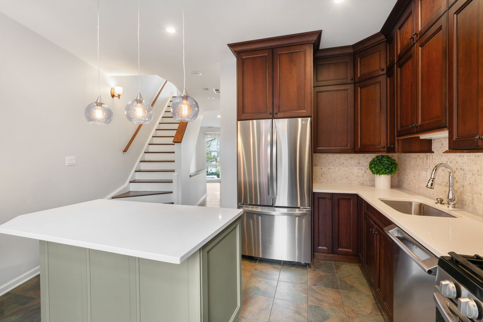 1522 South Prairie Avenue, Unit H Chicago, IL 60605 - Photo 8 of 25 a kitchen with stainless steel appliances a refrigerator and a sink