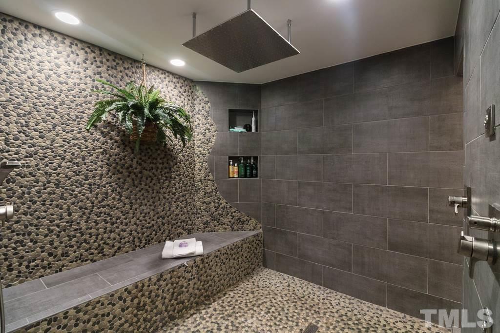 10025 Sycamore Road Raleigh, NC 27613 - Photo 14 of 30 a bathroom with a toilet and a shower