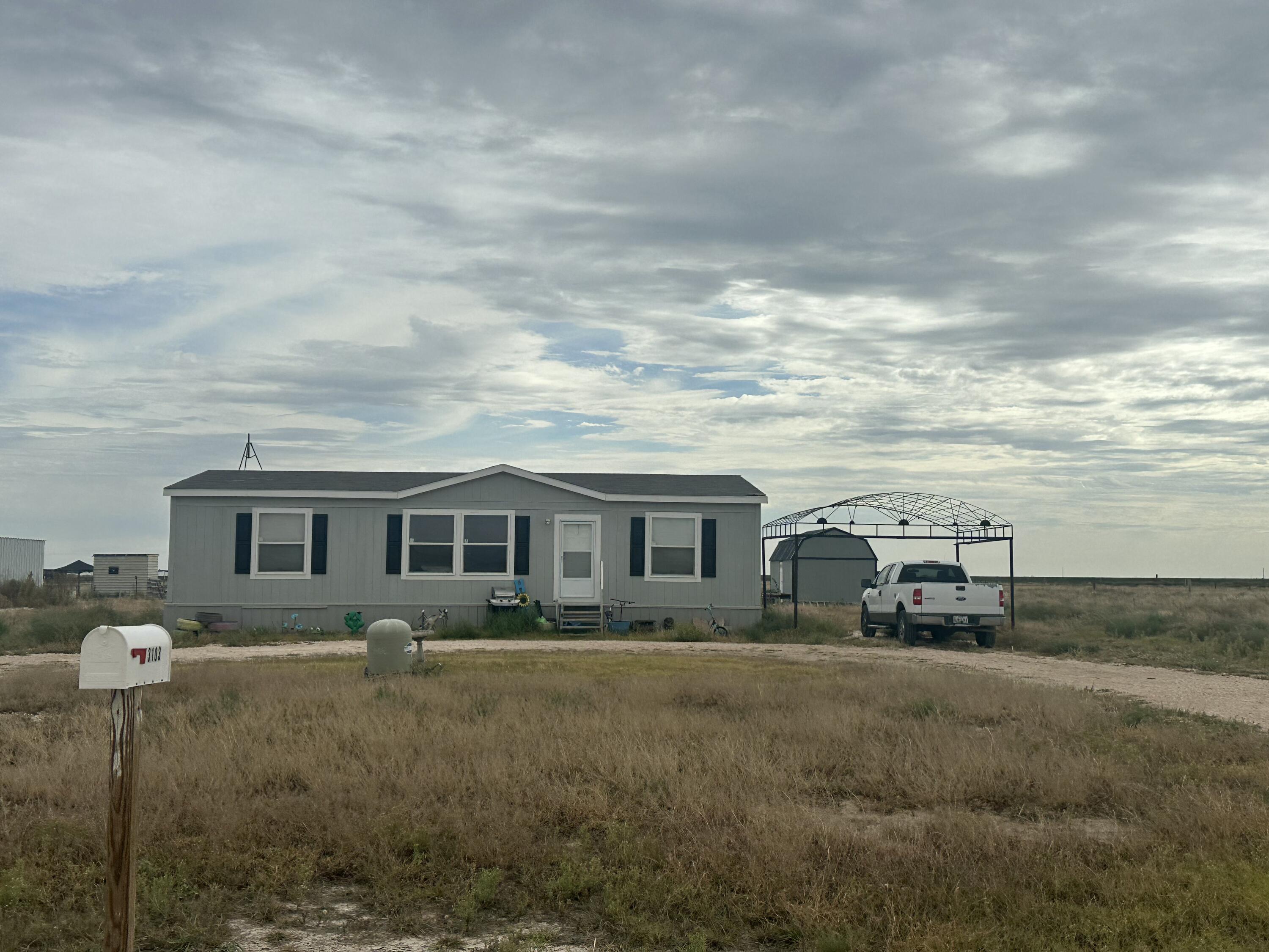 3103 Sparrow Road Lubbock, TX 79407 - Photo 1 of 1 a front view of a house with a yard