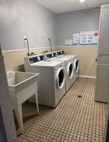 a utility room with washer and dryer