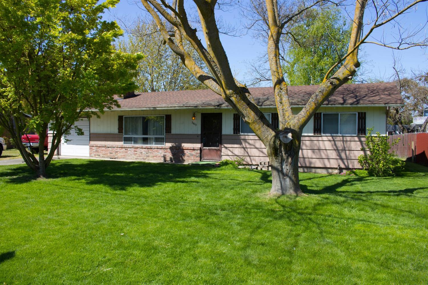 2613 Table Rock Road Medford, OR 97501 - Photo 1 of 23 a front view of a house with garden