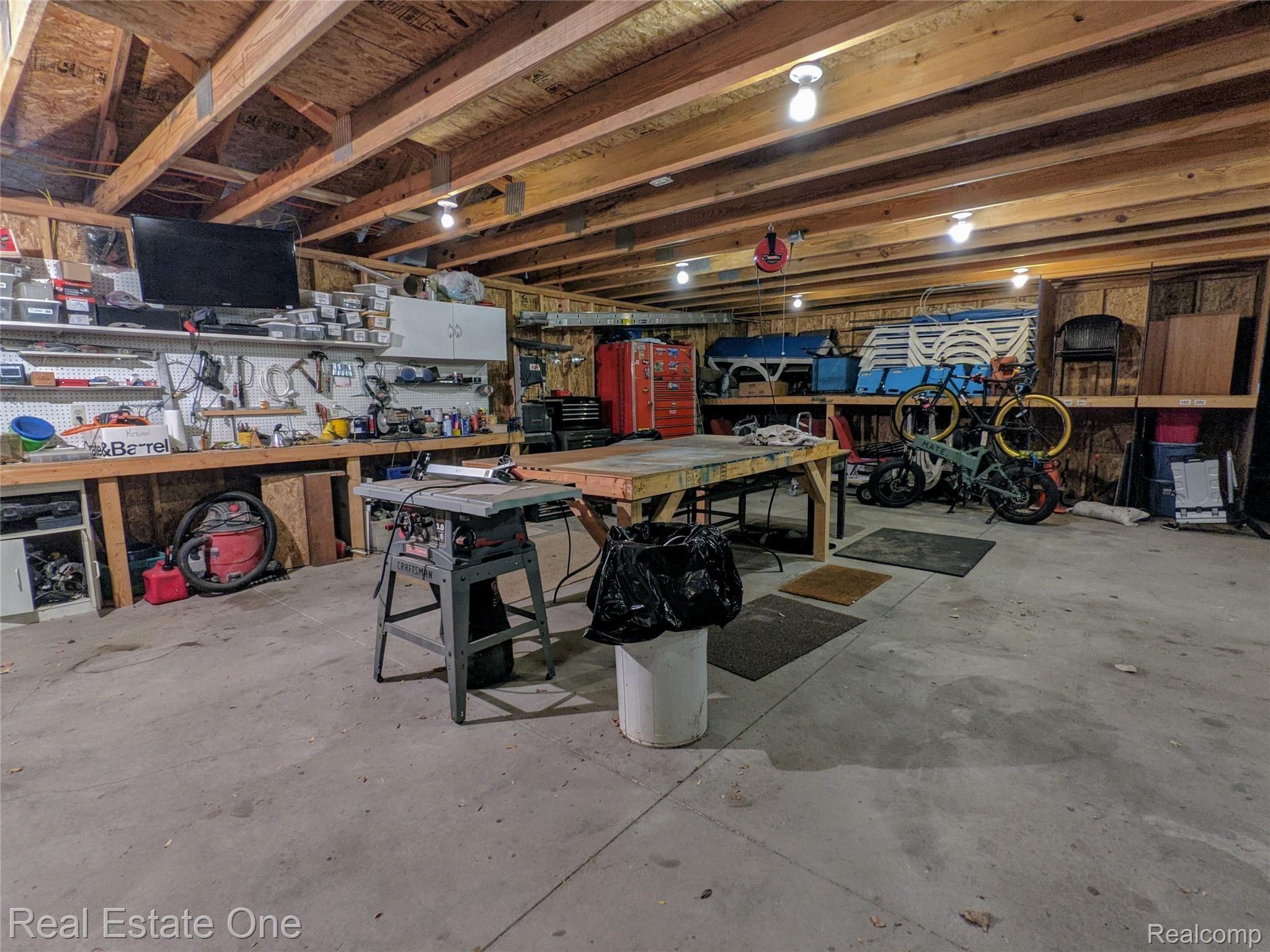 1506 Normandy Road, Unit 210 Royal Oak, MI 48073 - Photo 20 of 25 Shared garage with workshop and storage