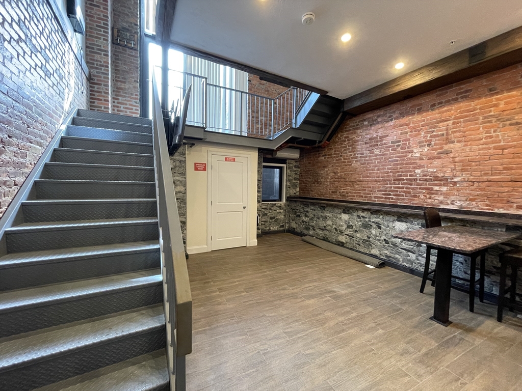 a view of entryway with wooden stairs