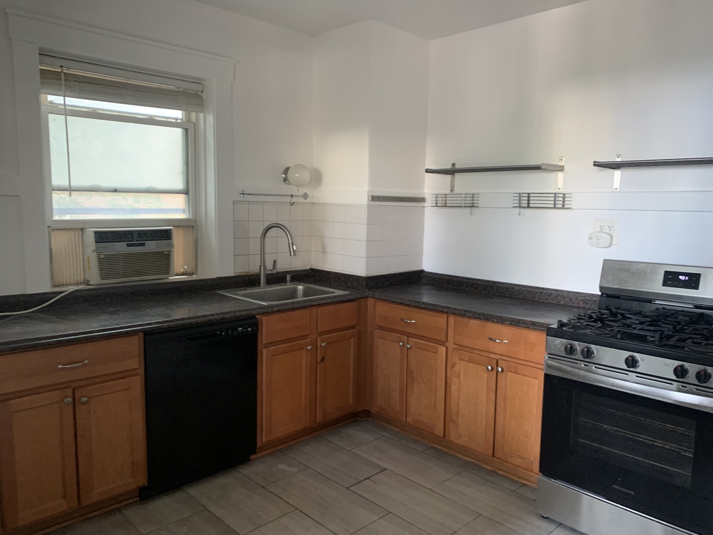 1505 Maple Avenue, Unit 2 Evanston, IL 60201 - Photo 2 of 2 a kitchen with granite countertop a sink stove and cabinets