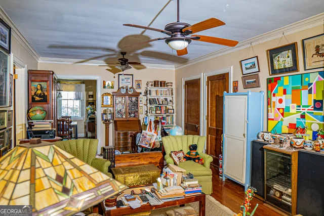 a view of a livingroom with furniture and a flat screen tv
