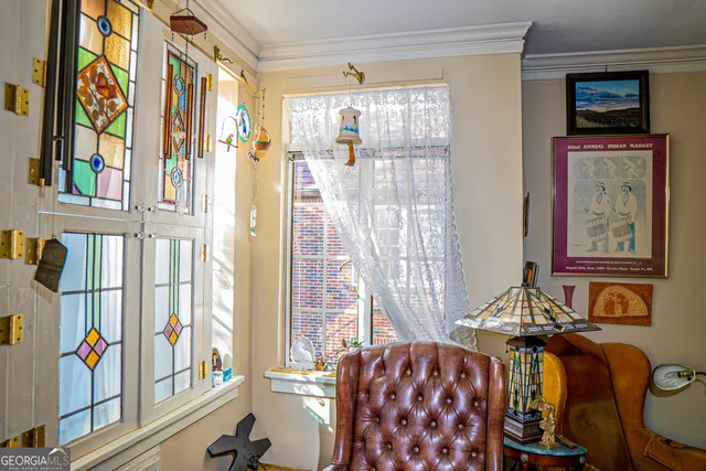a living room filled with furniture and a book shelf