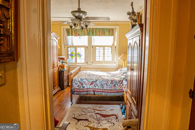 a bed room with a bed and a window