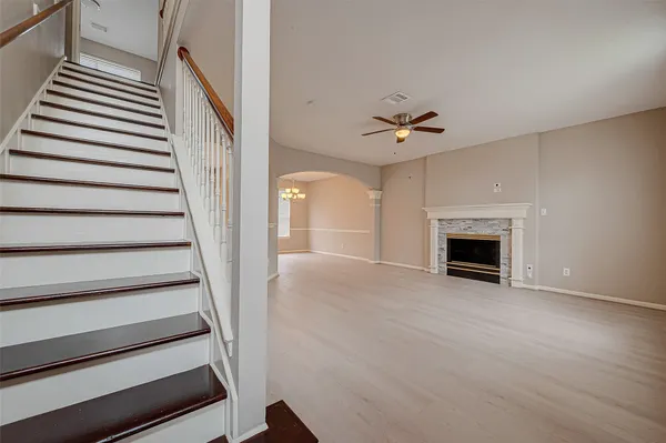 a view of an empty room with a fireplace