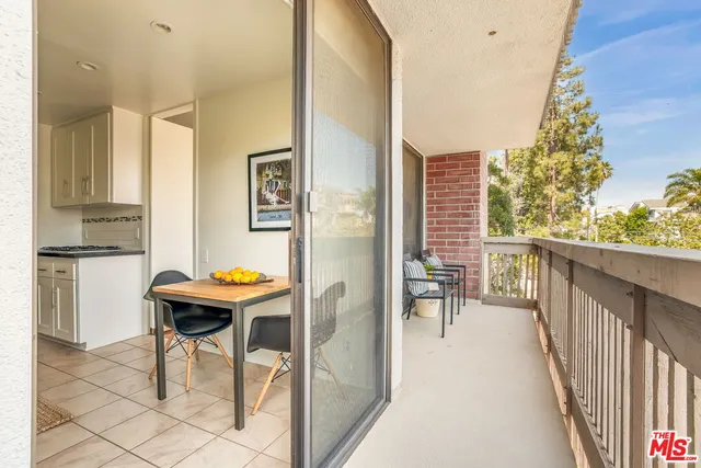 a view of a hallway with seating area