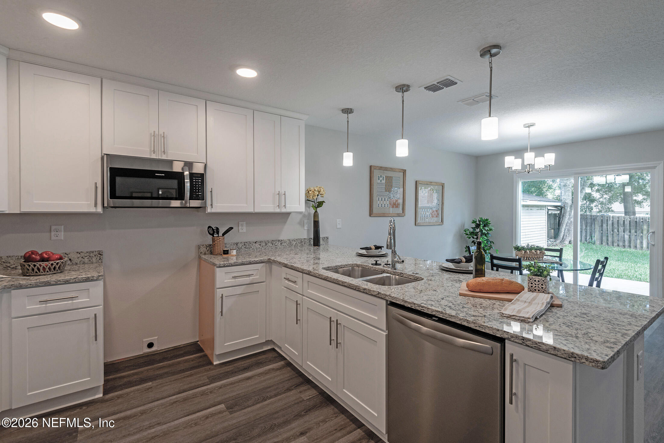 451 Cahoon Road North Jacksonville, FL 32220 - Photo 12 of 33 a kitchen with a sink stove and microwave