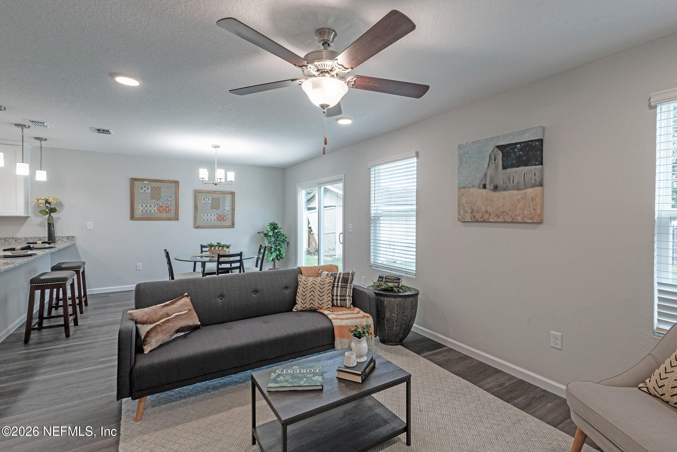 451 Cahoon Road North Jacksonville, FL 32220 - Photo 20 of 33 a living room with furniture a ceiling fan and a window