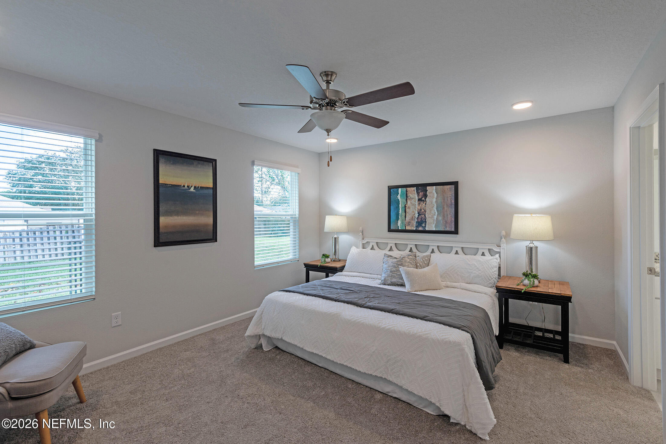 451 Cahoon Road North Jacksonville, FL 32220 - Photo 21 of 33 a bedroom with a bed and a chair