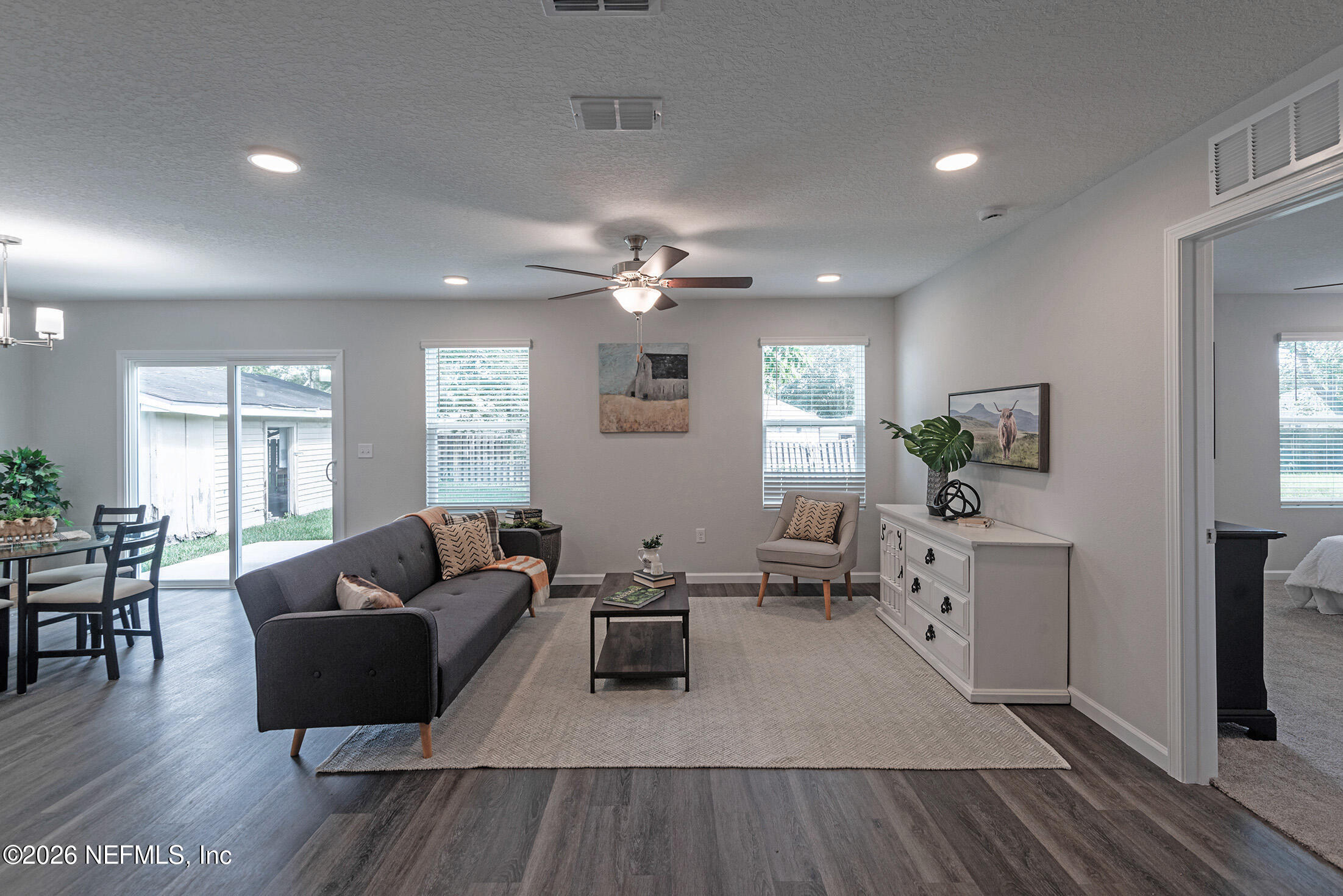 451 Cahoon Road North Jacksonville, FL 32220 - Photo 9 of 33 a living room with furniture and wooden floor