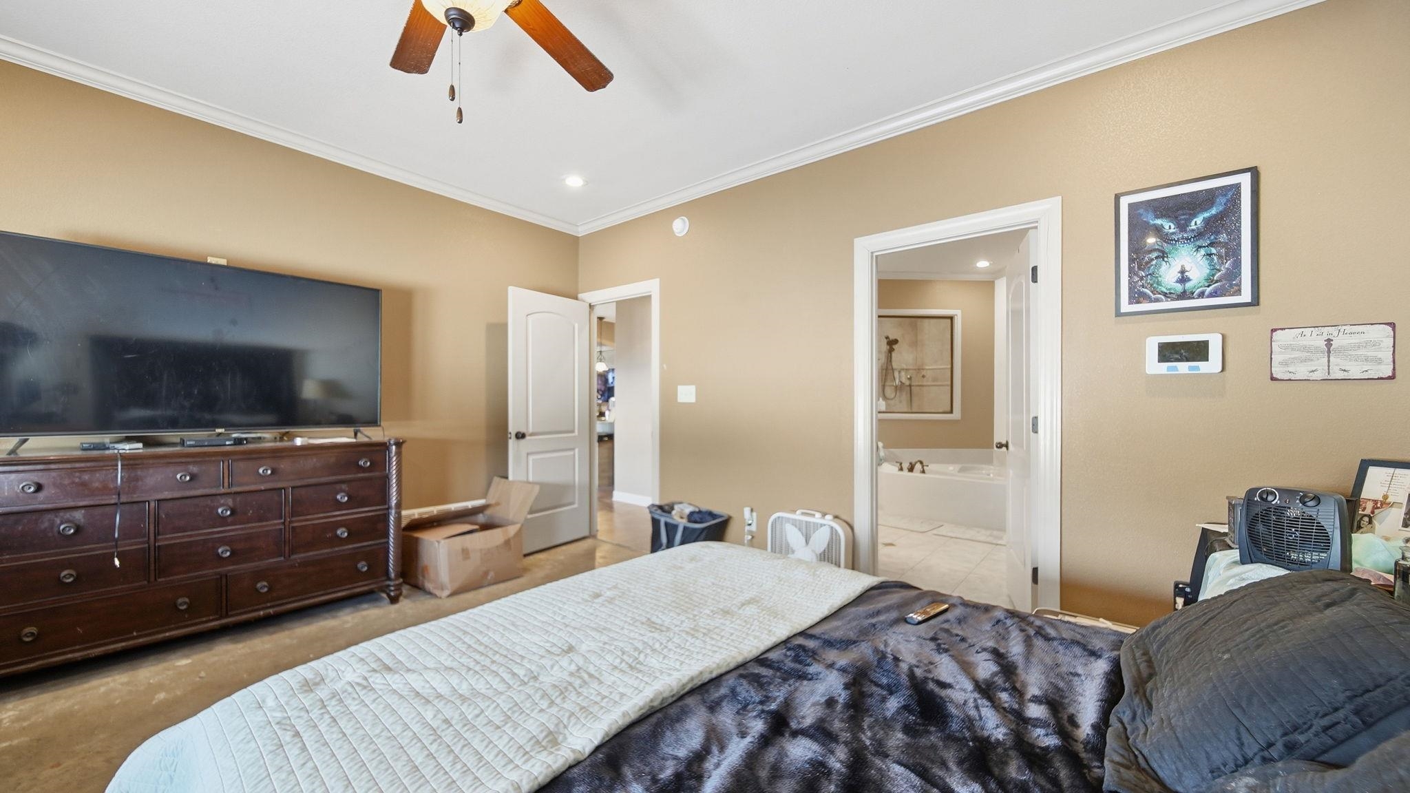 34 Carson Cove Atoka, TN 38004 - Photo 16 of 27 a bedroom with a bed and a flat screen tv