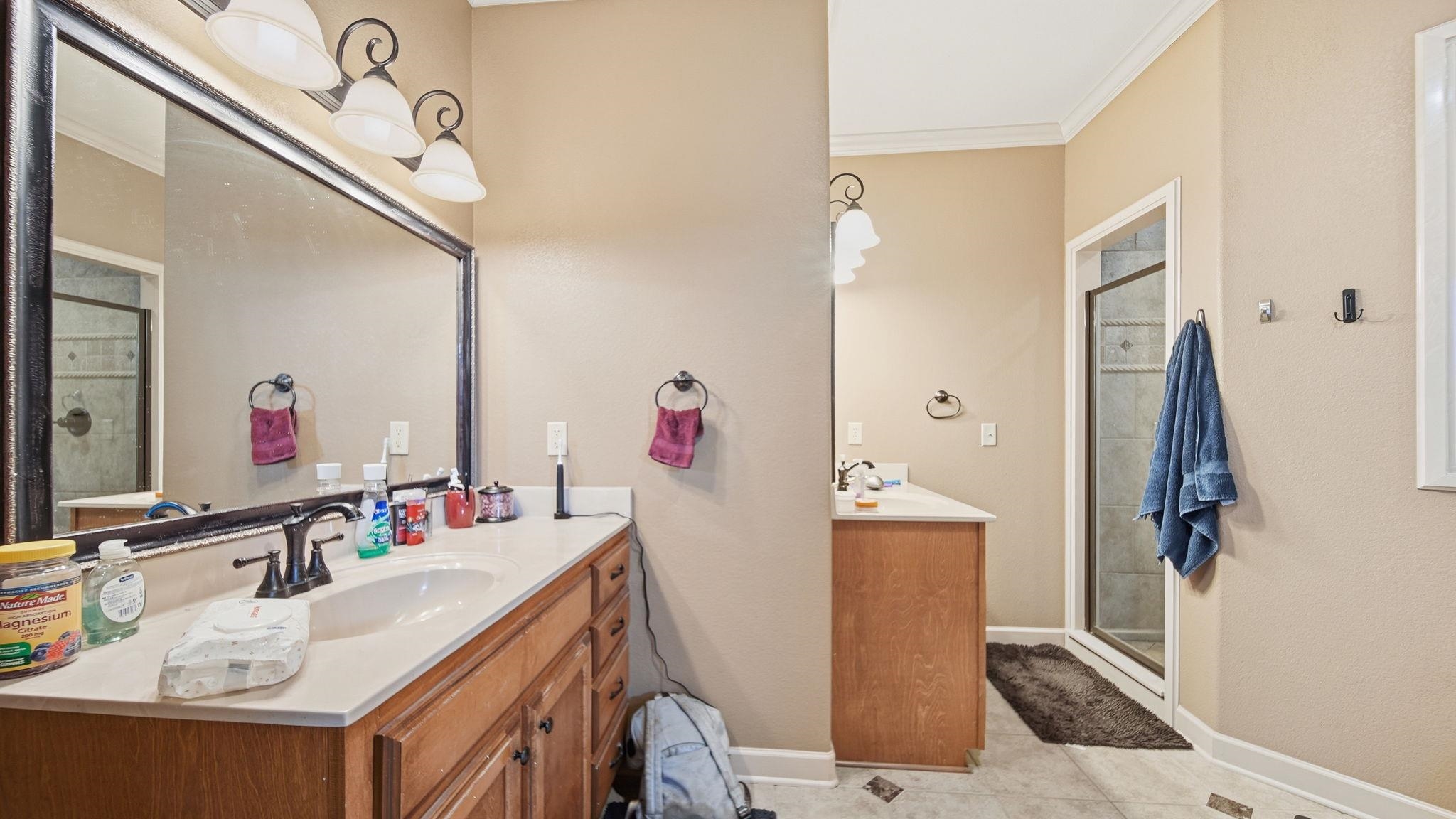 34 Carson Cove Atoka, TN 38004 - Photo 19 of 27 a bathroom with a sink vanity and mirror