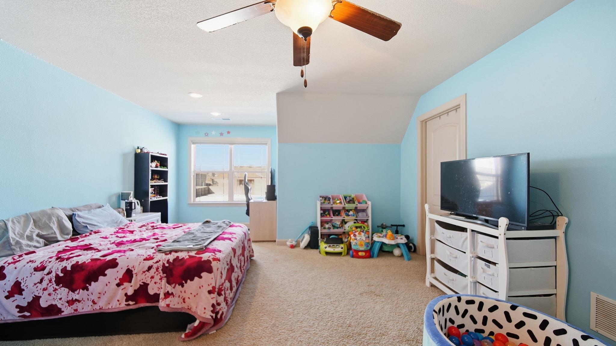 34 Carson Cove Atoka, TN 38004 - Photo 24 of 27 a bedroom with a bed and a flat screen tv