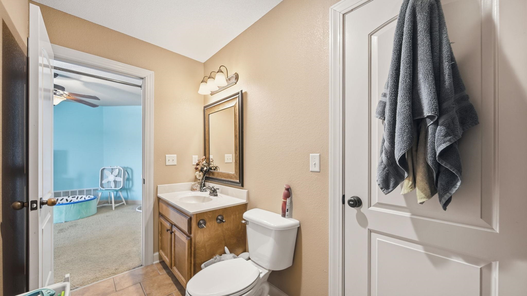 34 Carson Cove Atoka, TN 38004 - Photo 25 of 27 a bathroom with a toilet a sink and a mirror