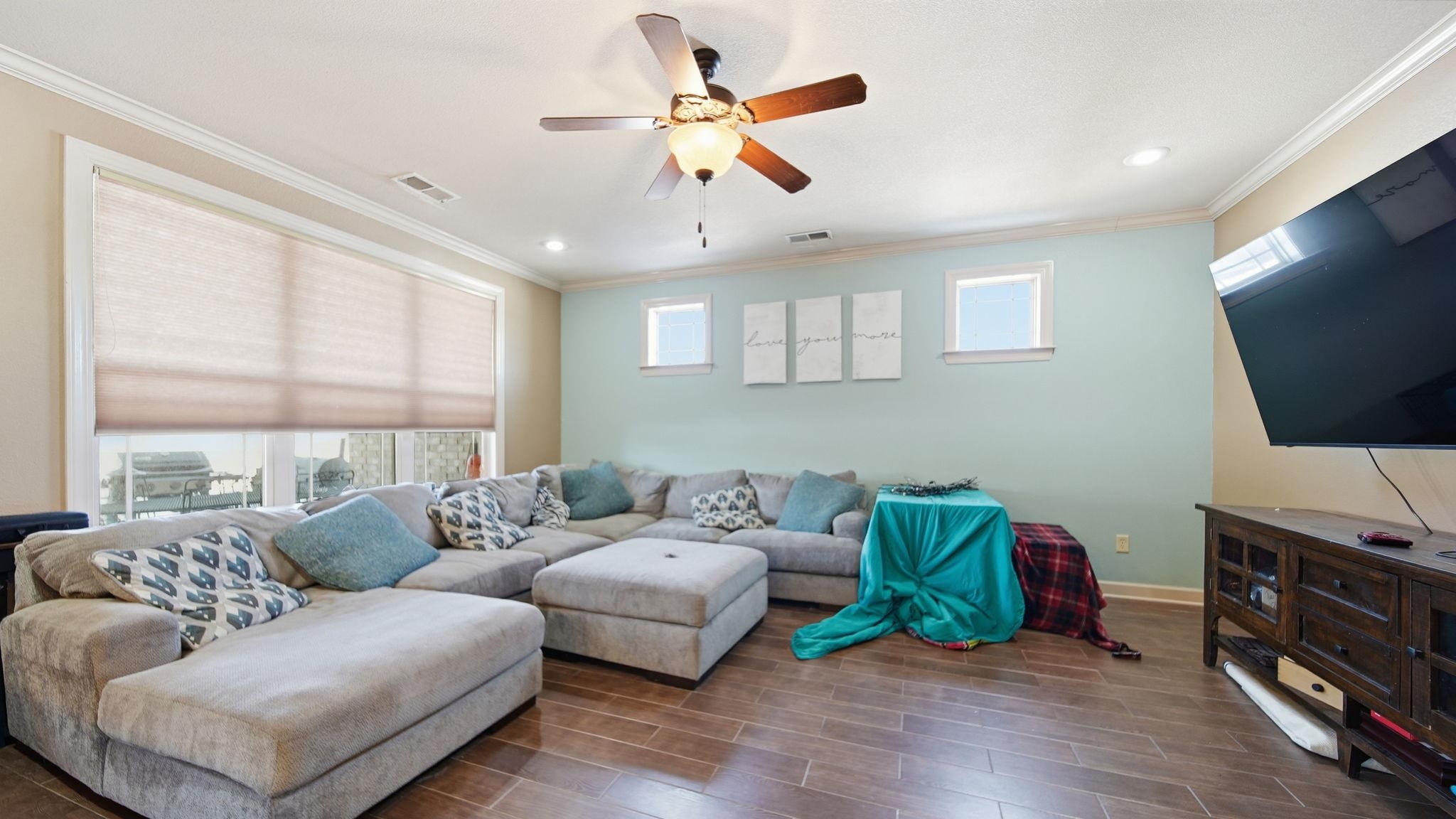 34 Carson Cove Atoka, TN 38004 - Photo 6 of 27 Living room with ornamental molding, wood finish floors, ceiling fan, plenty of natural light, and recessed lighting