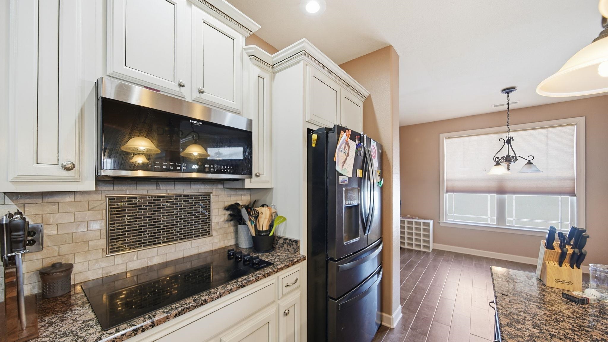 34 Carson Cove Atoka, TN 38004 - Photo 9 of 27 a kitchen with stainless steel appliances granite countertop a refrigerator and a stove top oven