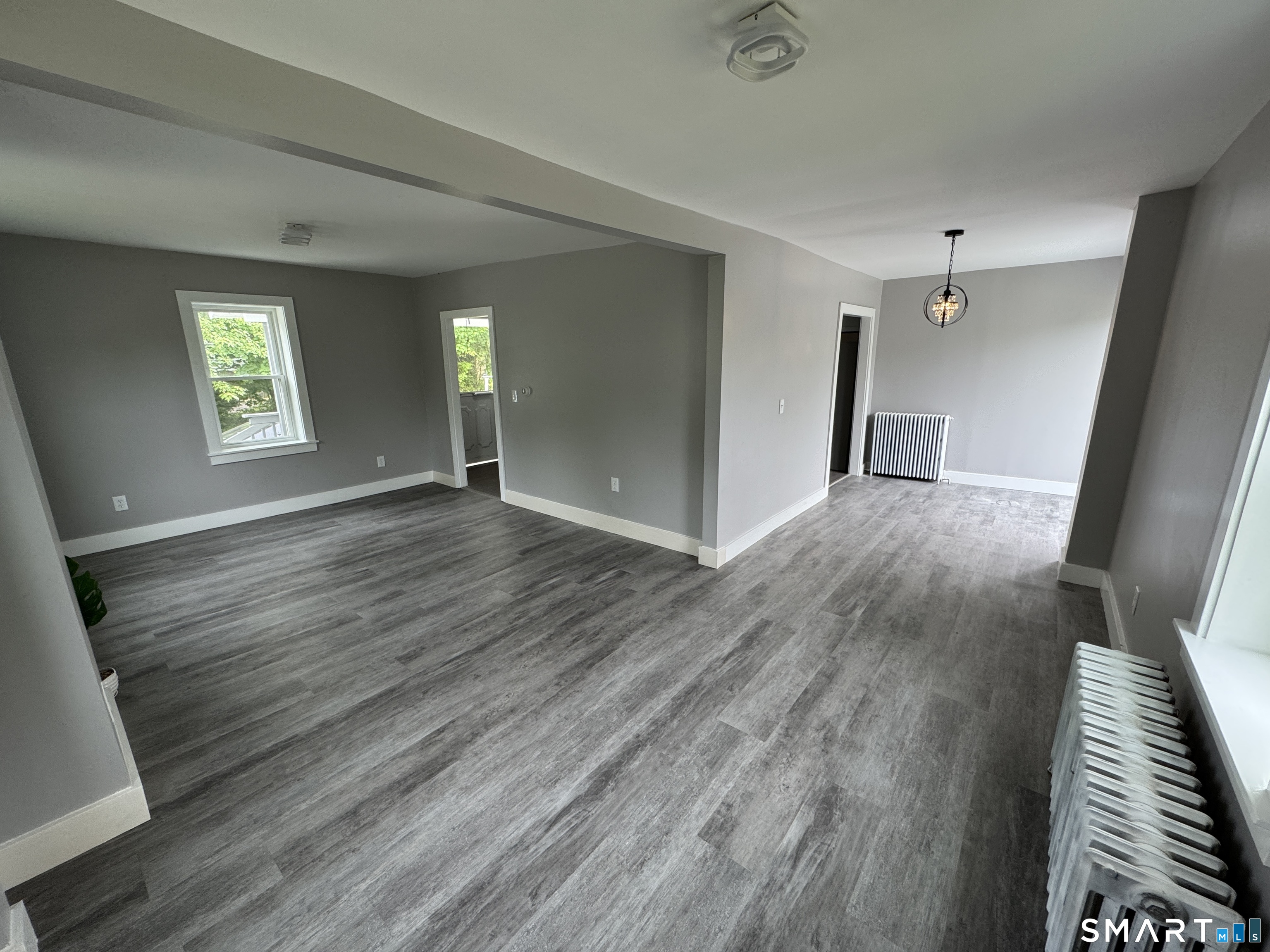 10 Center Street Windsor Locks, CT 06096 - Photo 18 of 25 wooden floor in an empty room with a window