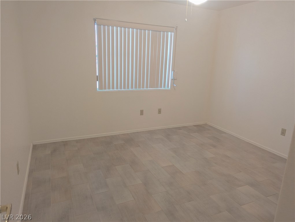 9433 Quail Ridge Drive Las Vegas, NV 89134 - Photo 12 of 23 Sun-filled room featuring modern tiled flooring and ample natural light.