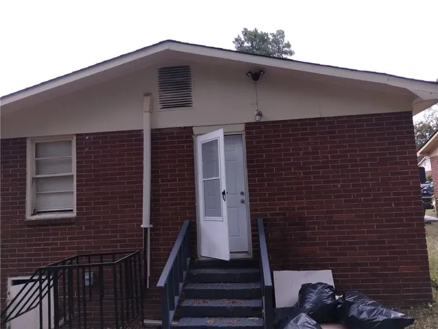 a view of a brick house with a small space