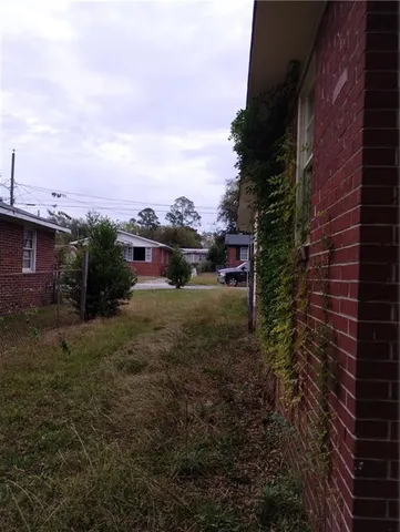 a view of a yard in front of a house