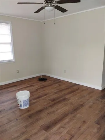 a view of a small space with wooden floor