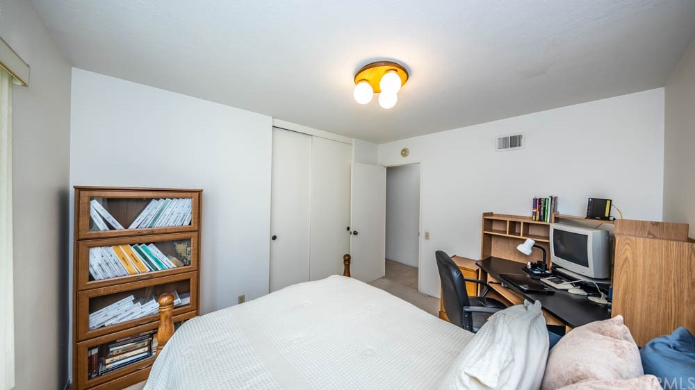 3540 Vista Glen Circle Yorba Linda, CA 92886 - Photo 26 of 31 a bedroom with a bed and a bookshelf