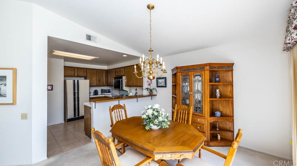 3540 Vista Glen Circle Yorba Linda, CA 92886 - Photo 9 of 31 a view of a dining room with furniture and chandelier