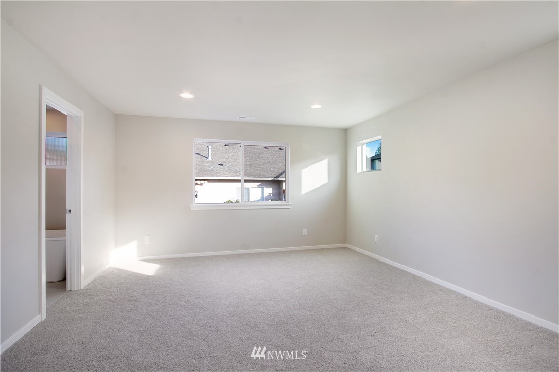 210 180th Place Southwest, Unit CT 01 Bothell, WA 98012 - Photo 11 of 19 a view of empty room with a fireplace