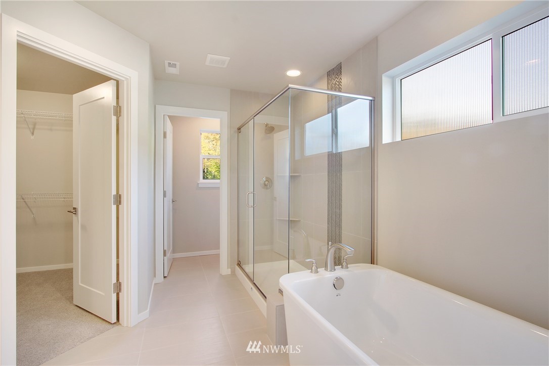 210 180th Place Southwest, Unit CT 01 Bothell, WA 98012 - Photo 13 of 19 a spacious bathroom with a bathtub and shower