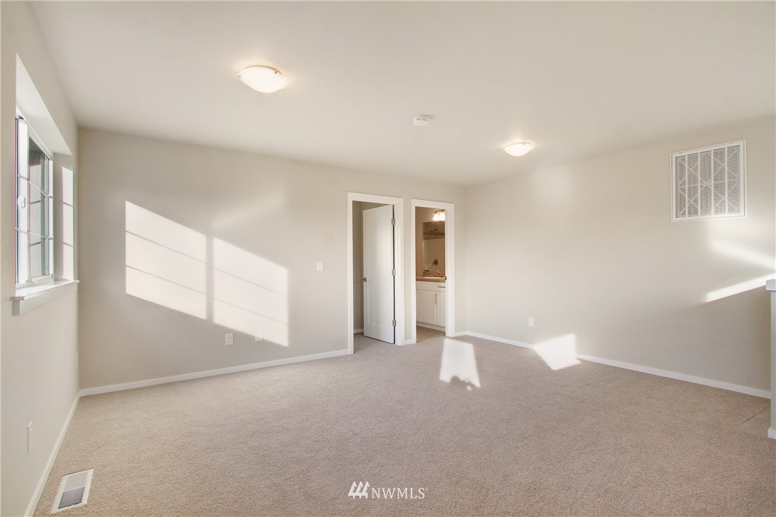 210 180th Place Southwest, Unit CT 01 Bothell, WA 98012 - Photo 15 of 19 a view of empty room with windows