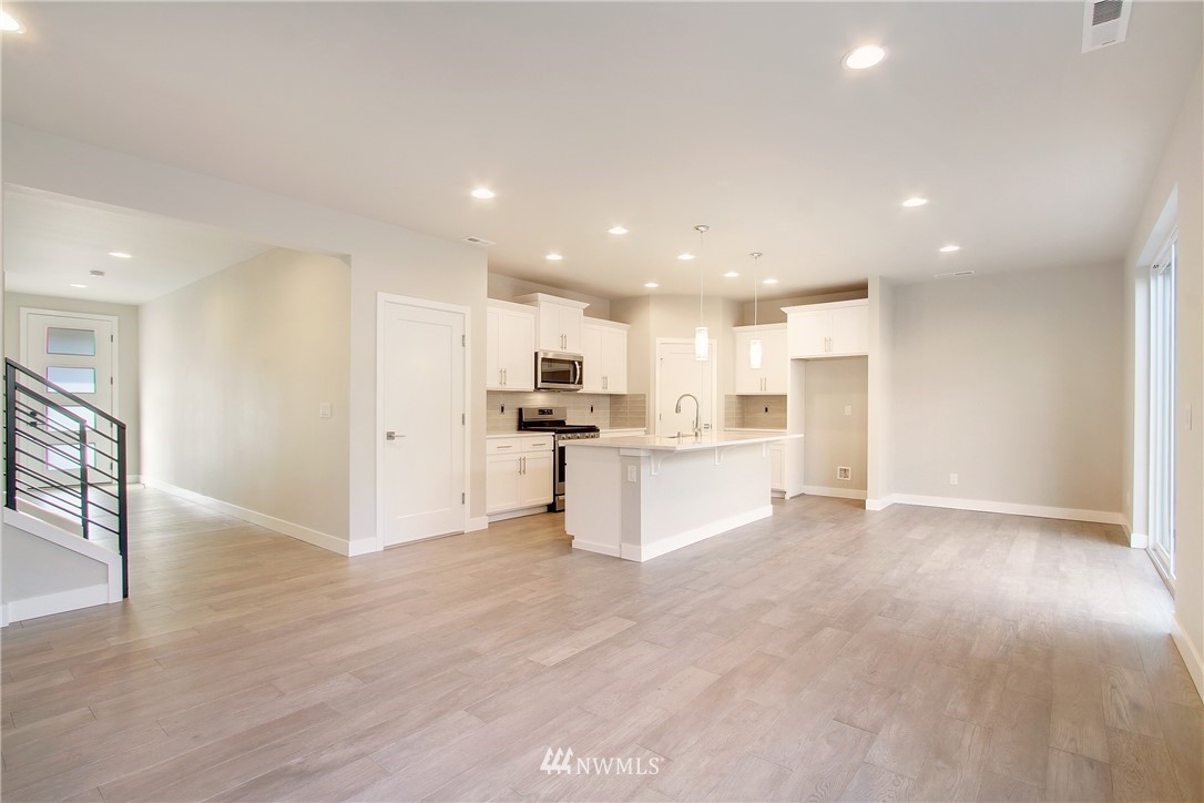 210 180th Place Southwest, Unit CT 01 Bothell, WA 98012 - Photo 4 of 19 a view of kitchen with kitchen island and stainless steel appliances