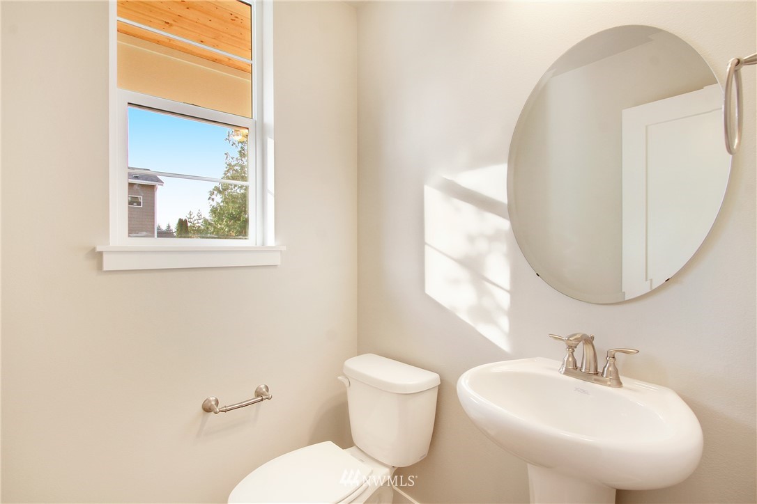 210 180th Place Southwest, Unit CT 01 Bothell, WA 98012 - Photo 9 of 19 a bathroom with a toilet sink and mirror