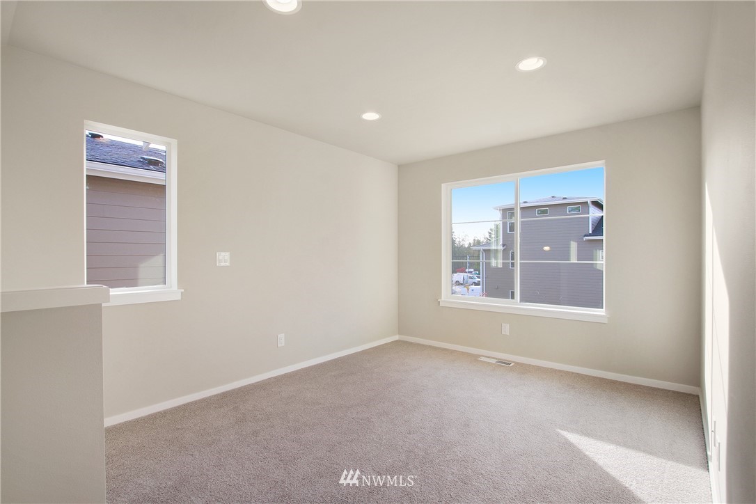 210 180th Place Southwest, Unit CT 01 Bothell, WA 98012 - Photo 10 of 19 a view of an empty room with a window